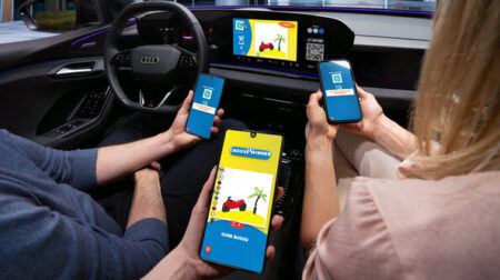 Passengers in a car play a connected game on their smartphones.