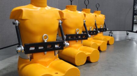 A range of orange FADs in a line leading away from the camera