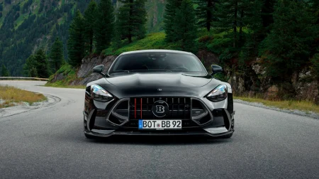 Brabus 1000 – the Mercedes-AMG GT 63 S E Performance reimagined The Brabus 1000 drives on a quiet mountain road with evergreen trees lining the tarmac