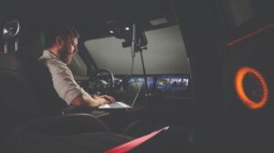 Sound engineer testing vehicle audio.