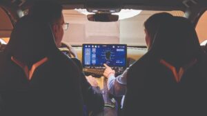 Automotive interior engineers discussing the infotainment system.