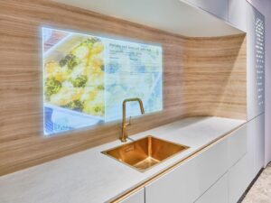 The integrated screen only appears behind the translucent wood-effect surface when switched on.