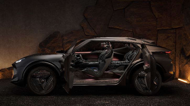 INTERVIEW: Combining performance and sustainability with Bcomp’s flax fiber in Cupra’s Tindaya The Tindaya Showcar shown in profile, with the left-hand side doors open to reveal the interiors, against an atmospheric black and dark-brown background