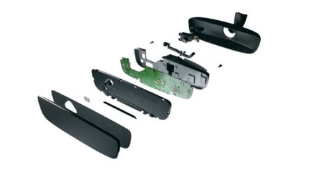 Magna’s mirror-integrated Driver and Occupant Monitoring System taken apart to show each individual piece.