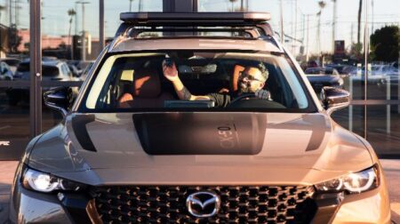 Nextbase launches Vehicle Accessory as a Service platform and partners with Mazda A driver adjusting Nextbase's dash cam in a Mazda vehicle