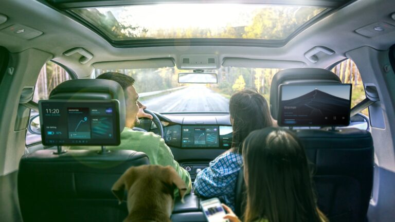 Visual of a family in the cabin surrounded by digital cockpit technology.