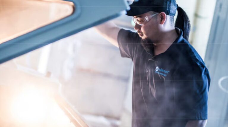 Element Materials Technology achieves Volkswagen accreditation for materials testing A mechanic lifting the hood of a vehicle.