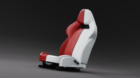 A white and red car seat made with Bridge of Weir's sustainable protein-based BioPro material.