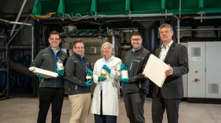 Covestro and Fraunhofer UMSICHT representatives pose at the signing of the contract for the collaboration on a new smart pyrolysis recycling pilot plant.