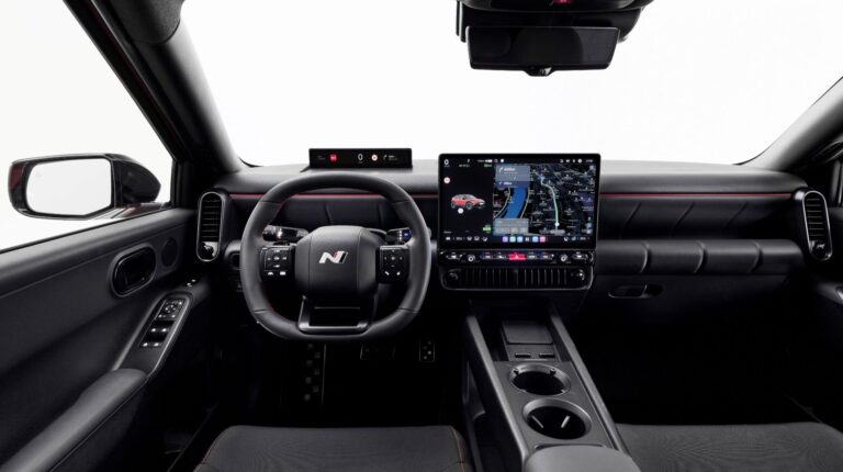 The Hundai Pleos Connect system on a black vehicle dashboard.