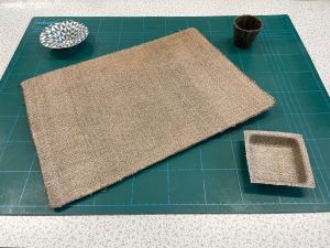 Flax and cotton composites showing different manufactured shapes (flat, tray, speaker cone, cup).