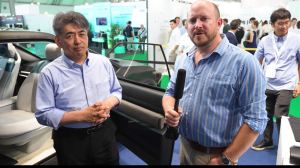 Sekisui's Design Studio director Masashi Yanai is interviewed by UKi's Lawrence Butcher on the show floor at Automotive Interiors Expo Europe 2026.