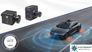 Automotive cameras and a diagram of a vehicle with orange circles around the wheels and underneath to demonstrate its sensors.